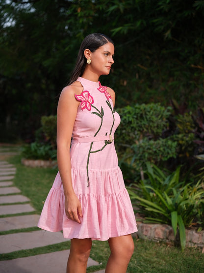 ESTELLE - A pink deep-cut dress with a two-tier gathered flare