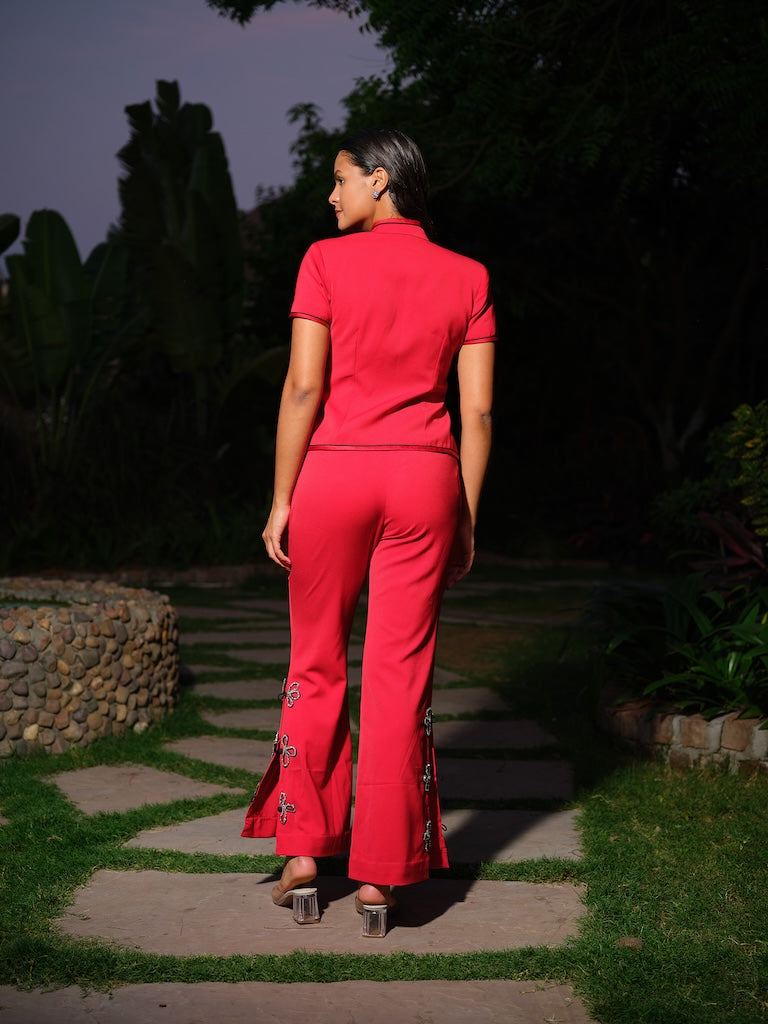 SERAPHINE -A bold red co-ord set paired with a mandarin jacket, matched with slit pants featuring bow accents.