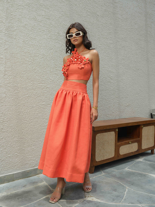 ELENA – Halter neck top paired with a skirt detailed at the waist