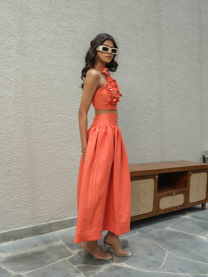 ELENA – Halter neck top paired with a skirt detailed at the waist