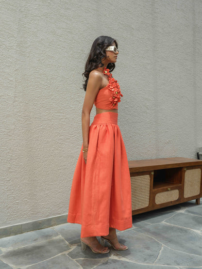 ELENA – Halter neck top paired with a skirt detailed at the waist