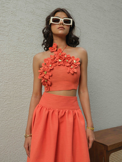 ELENA – Halter neck top paired with a skirt detailed at the waist