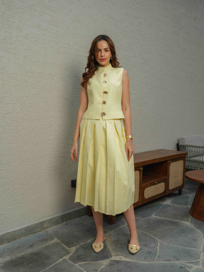 ZEST –  co-ord set with a sleeveless jacket featuring button detailing, paired with a box-pleated skirt