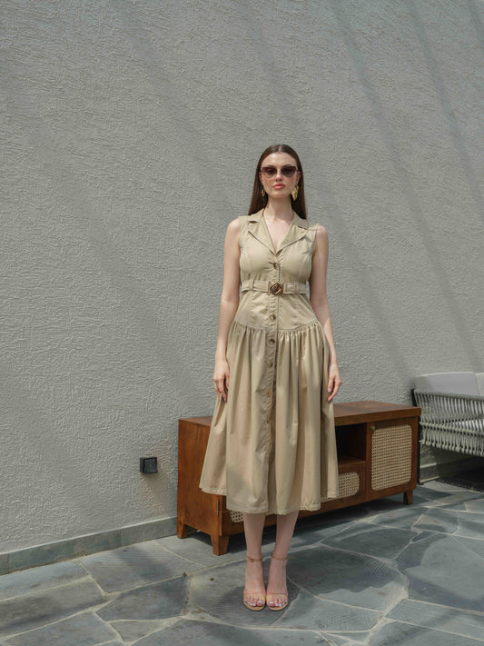 BUFFIE – A buff-colored dress with stone detailing and a belt featuring a metal buckle.