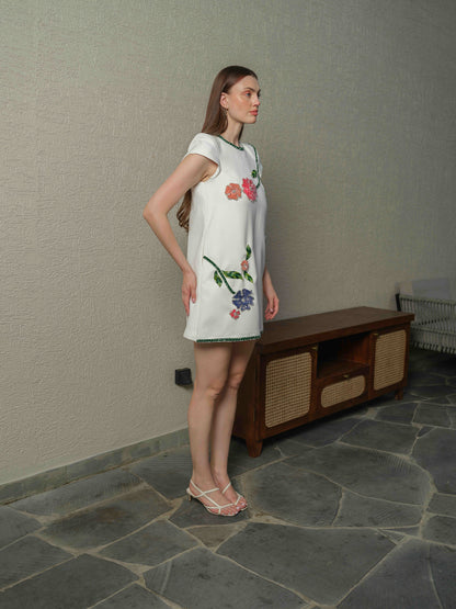 VENICE – A  white box-fit dress featuring exquisite applique work with 3D embroidery.