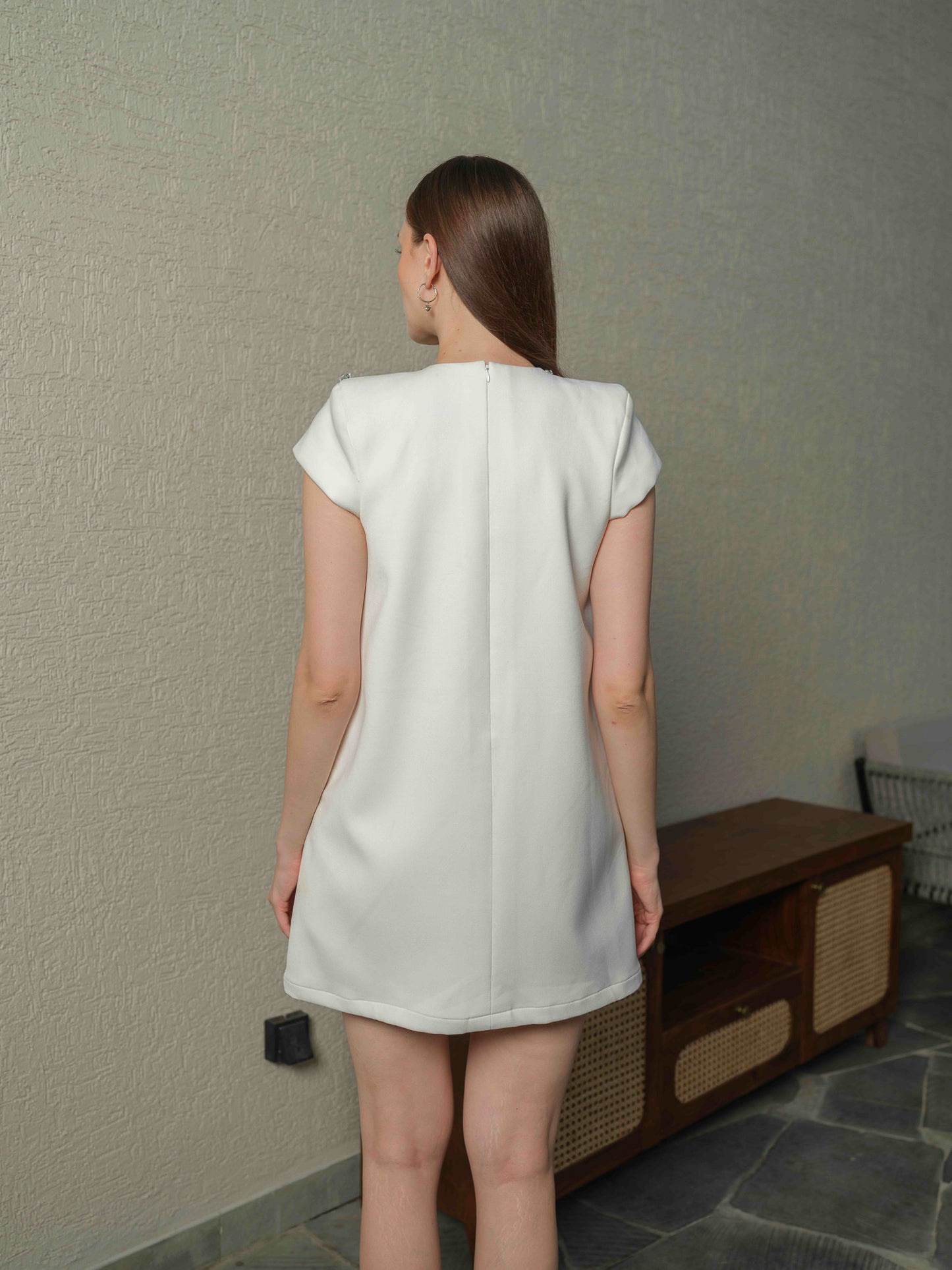 VENICE – A  white box-fit dress featuring exquisite applique work with 3D embroidery.