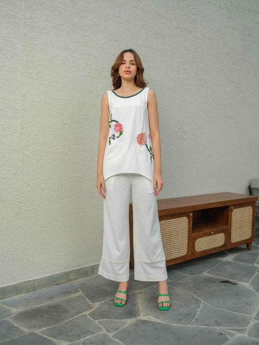 HAZEL – A co-ord set with an up-and-down top featuring applique work and 3D embroidery, paired with flared pants