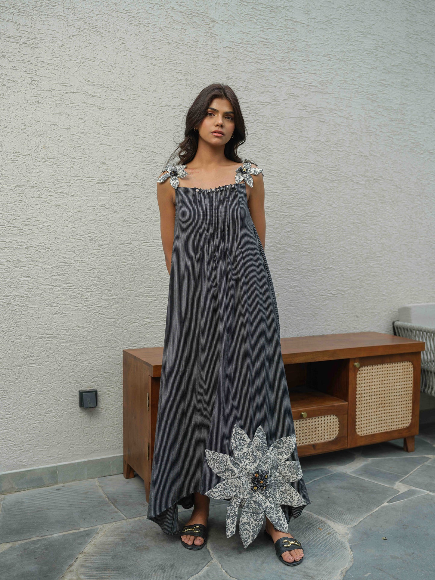 VETRA – A BLACK  dress with pleated neckline, flower detailing on the straps