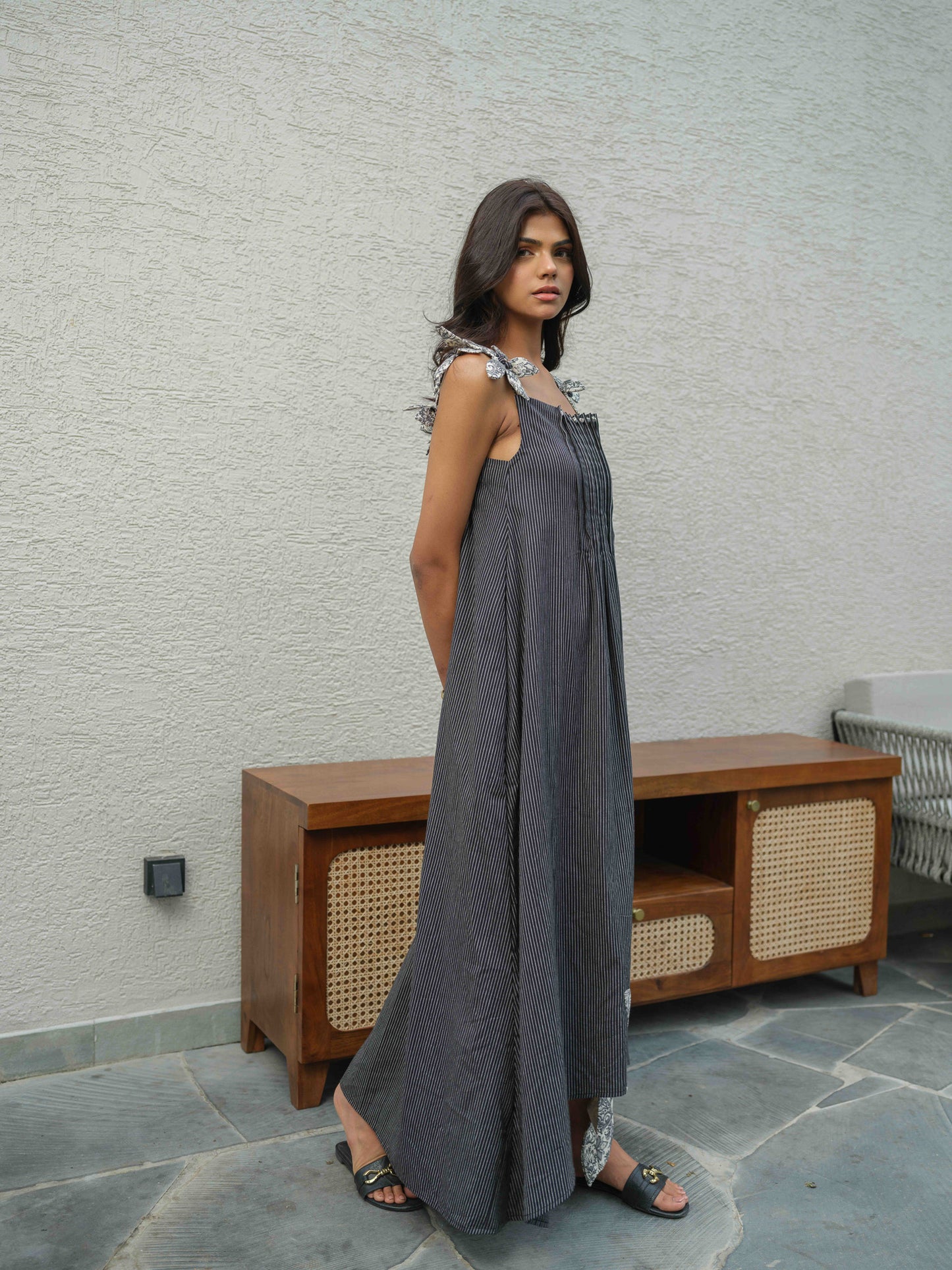 VETRA – A BLACK  dress with pleated neckline, flower detailing on the straps