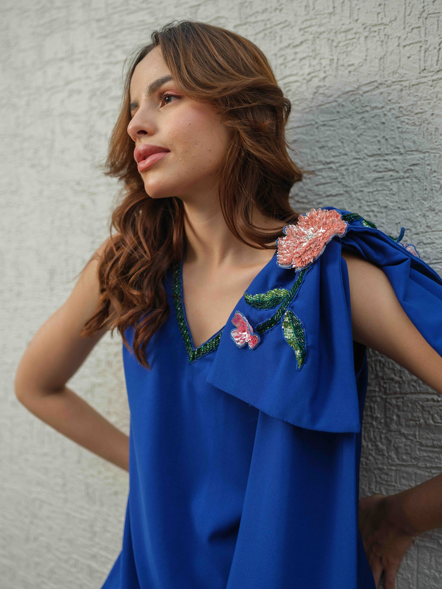 CARLA – An electric blue dress featuring bow detailing on the shoulder