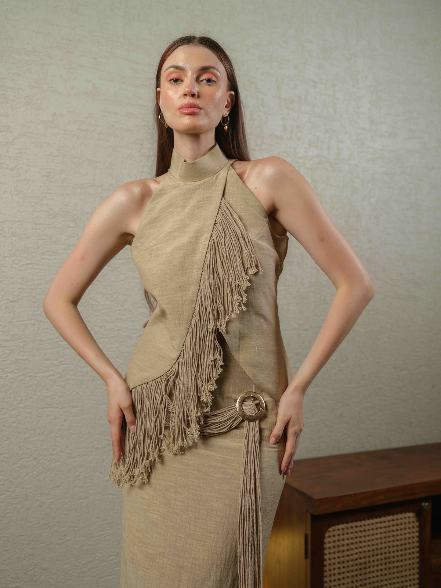 SWING – A co-ord set with a turtleneck top featuring fringe detailing, paired with a pencil-fit skirt