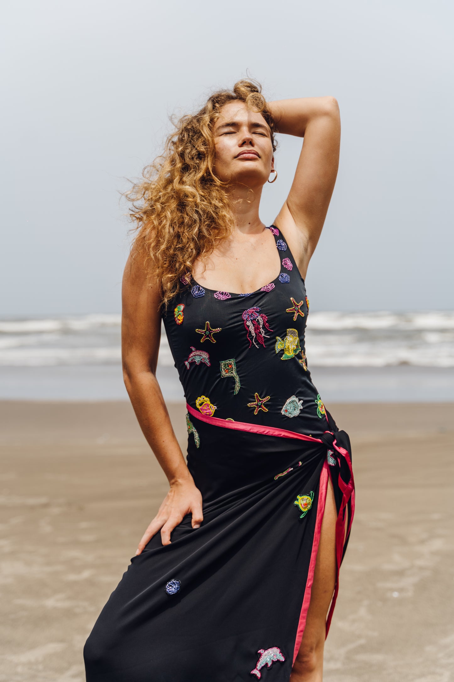 AQVI-  Black bodysuit adorned with  intricate embroidery of aquatic motifs