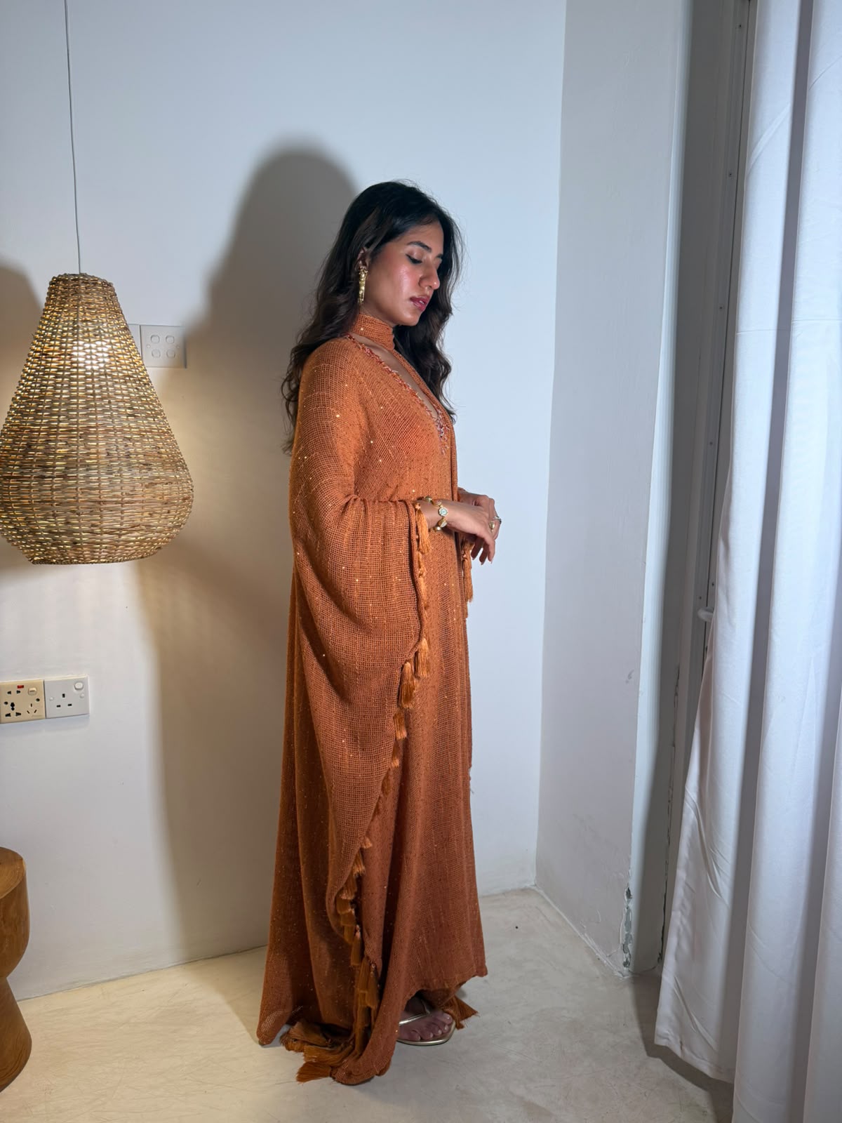 SOL — A vibrant orange kaftan with intricate V-neck detailing, paired with a graceful statement dupatta.