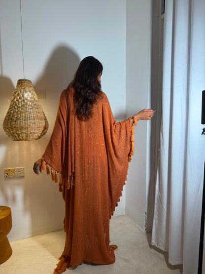 SOL — A vibrant orange kaftan with intricate V-neck detailing, paired with a graceful statement dupatta.