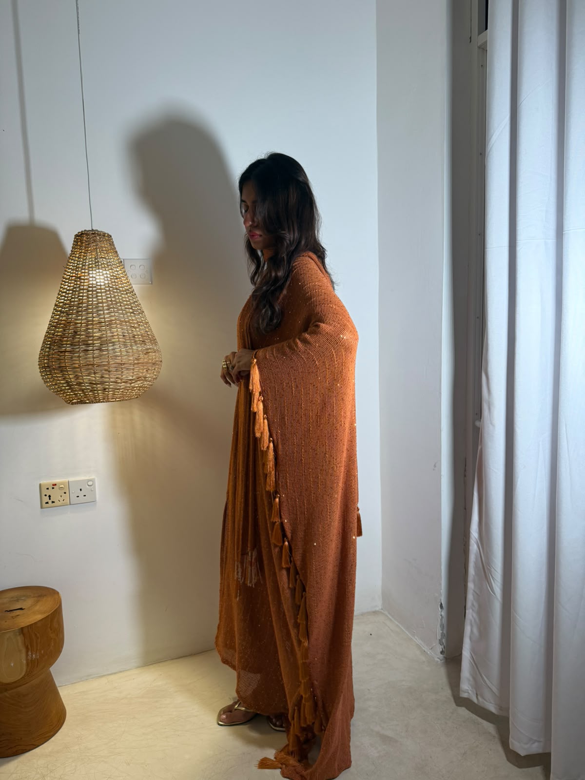 SOL — A vibrant orange kaftan with intricate V-neck detailing, paired with a graceful statement dupatta.