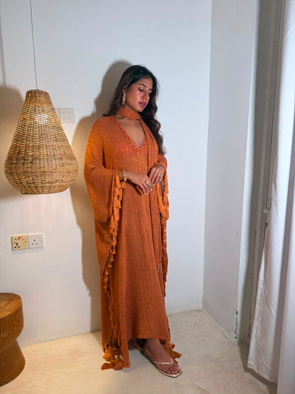 SOL — A vibrant orange kaftan with intricate V-neck detailing, paired with a graceful statement dupatta.