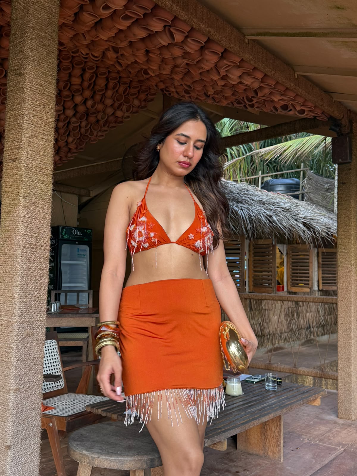 NOOR - A vibrant bralette with 3D floral detailing and playful latkans, paired with a stylish mini skirt and cheer organza cape.