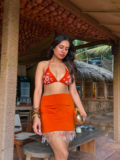 NOOR - A vibrant bralette with 3D floral detailing and playful latkans, paired with a stylish mini skirt and cheer organza cape.